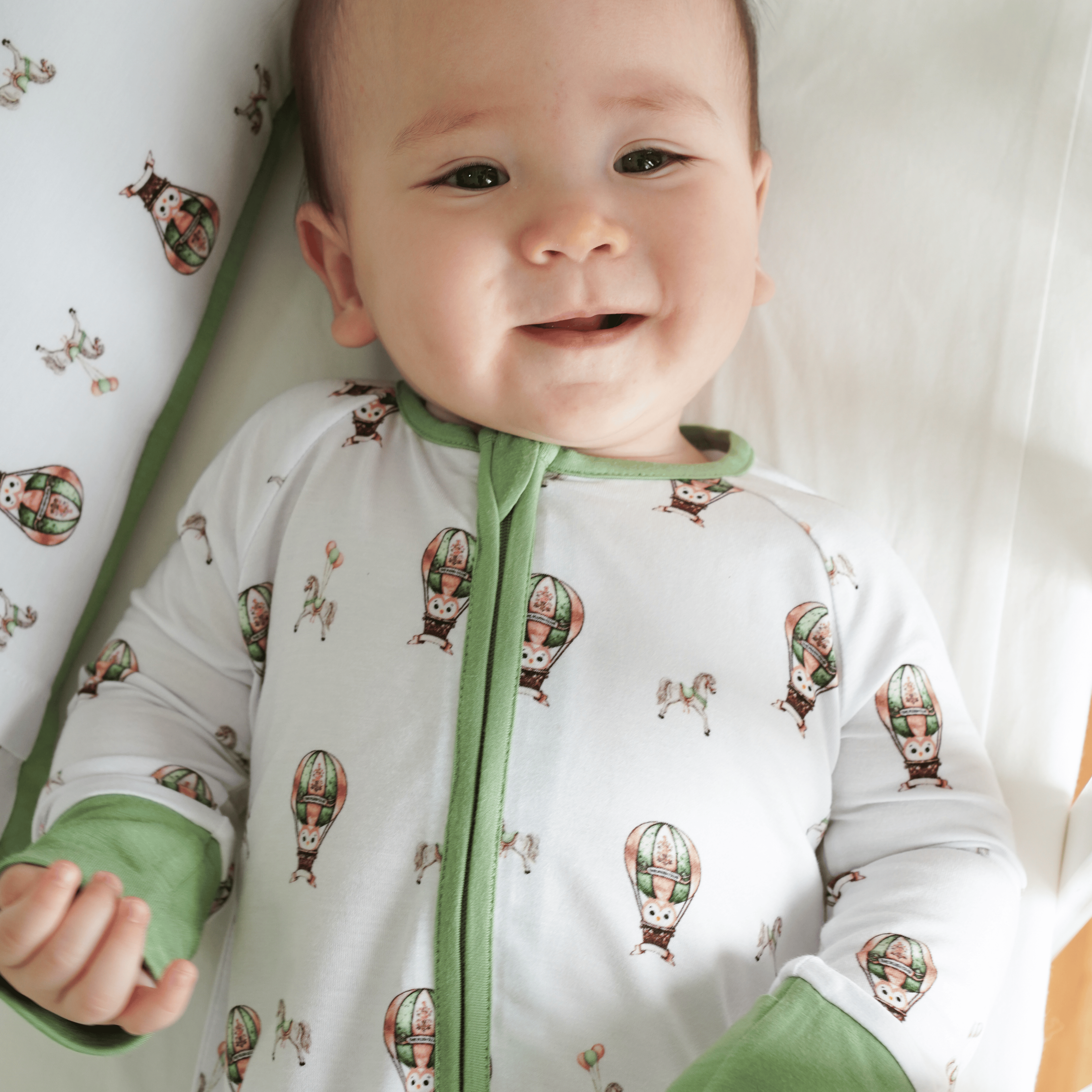 Owl Voyage onesie, swaddle and pillow combo